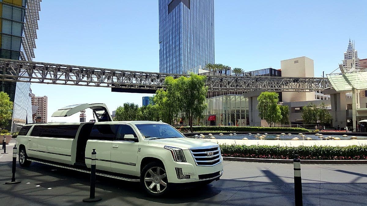 White Escalade super stretch limousine for a quinceanera
