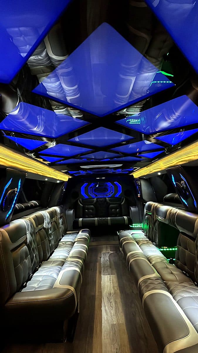 Interior of the 2024 Escalade super stretch with LED ceiling panels and lounge seating
