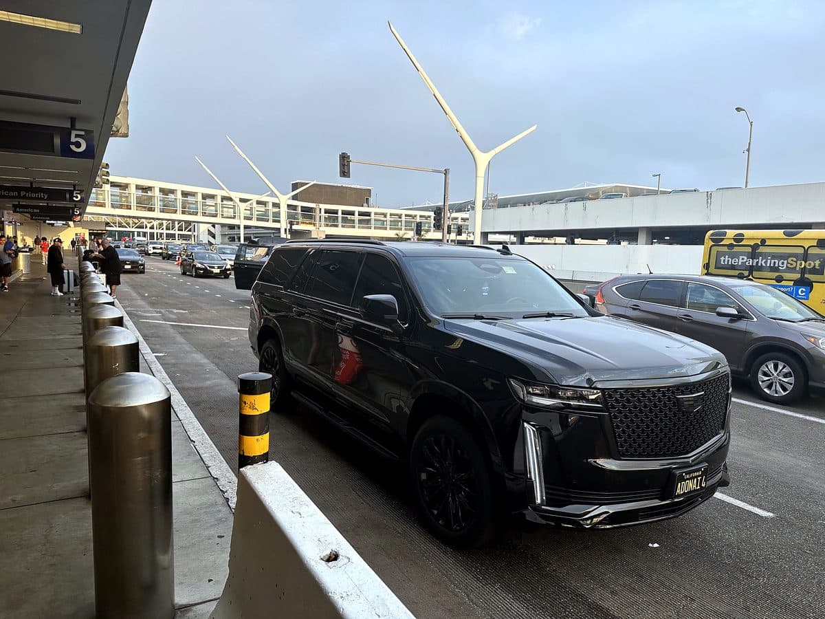 Cadillac Escalade ESV on an airport departures curb