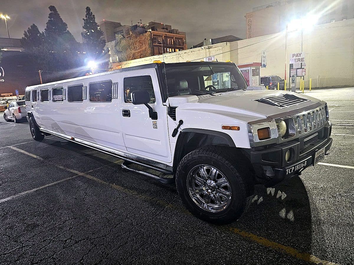 Hummer H2 stretch limousine at night before an event