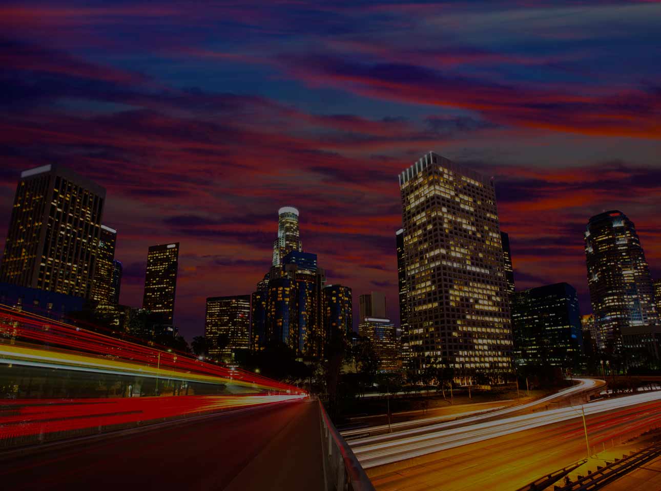 Los Angeles skyline representing concert and sports transportation